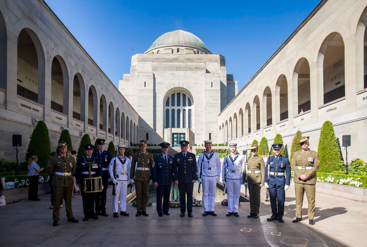 Military members pose for a group photo.