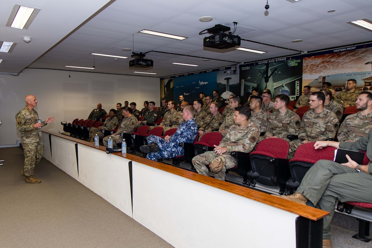 Military members are briefed by leadership.